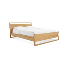 The full-size Woodrow Bed from Blu Dot made with white oak with pillows.