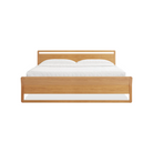 The king-size Woodrow Bed from Blu Dot made with white oak from the foot of the bed.