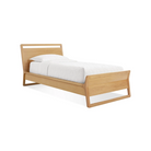 The twin-size Woodrow Bed from Blu Dot made with white oak from an angle.