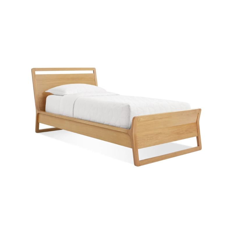 The twin-size Woodrow Bed from Blu Dot made with white oak from an angle.