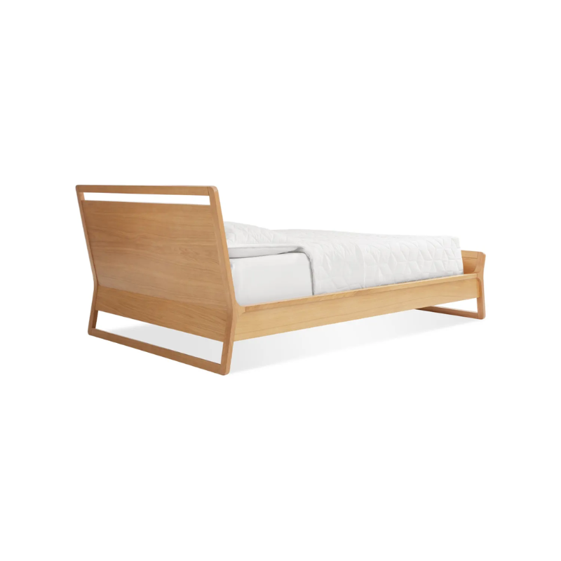 The twin-size Woodrow Bed from Blu Dot made with white oak from the back at an angle.