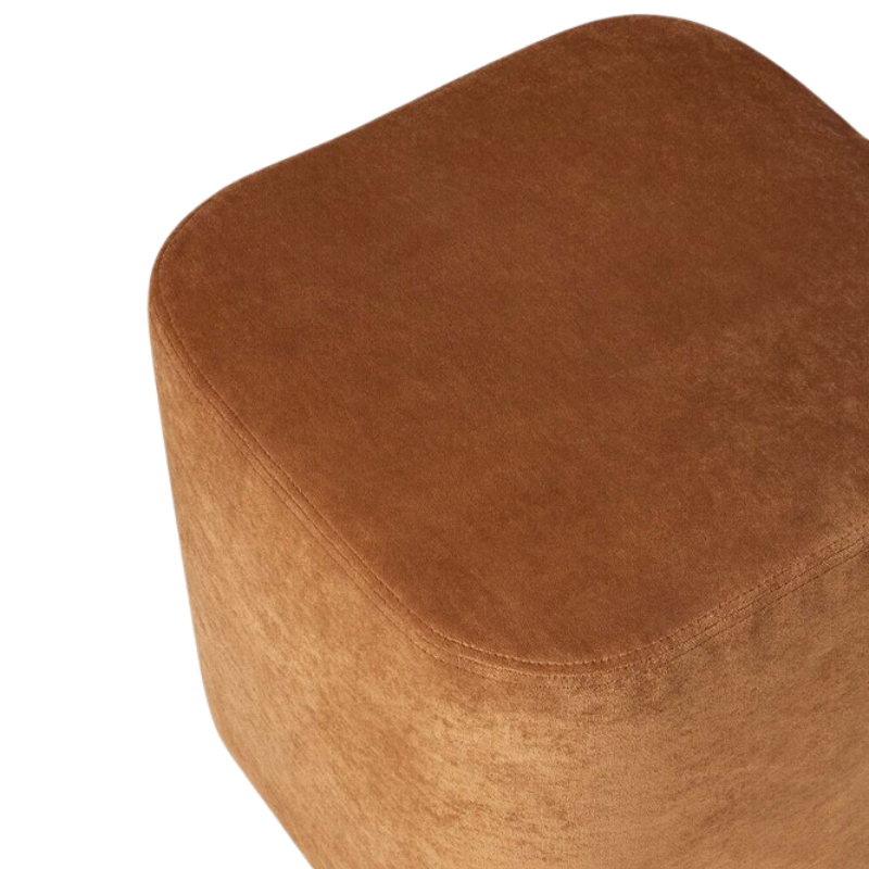 The Cube Pouf from Ethnicraft in cinnamon seat.