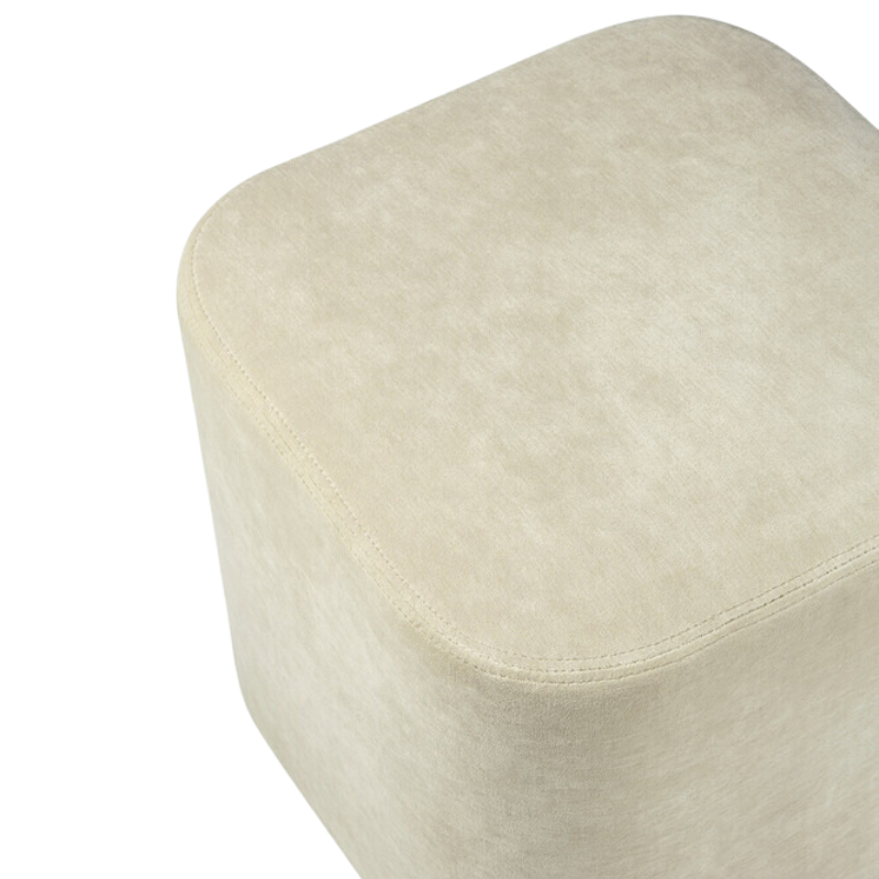 The Cube Pouf from Ethnicraft in sand seat.