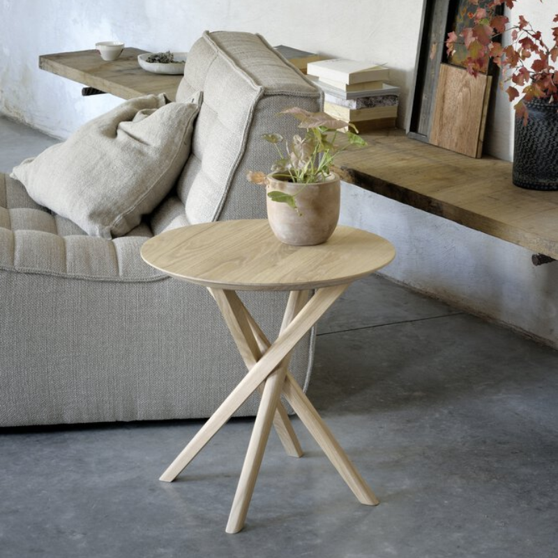 The Mikado Side Table from Ethnicraft in a living room.