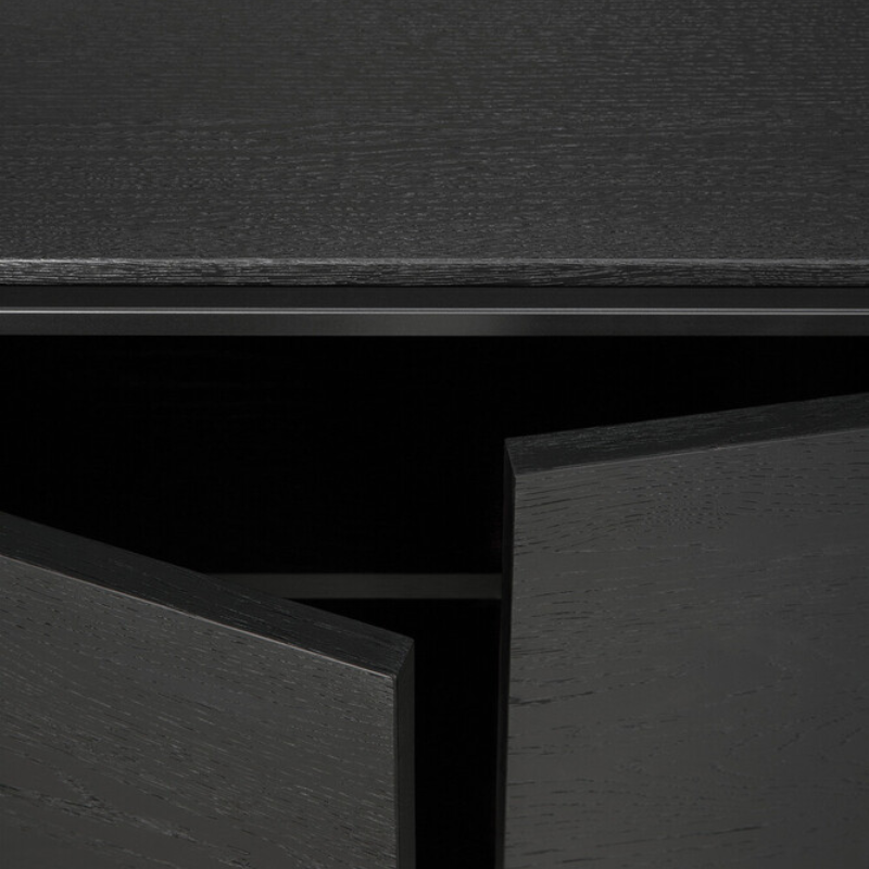 The Monolit Sideboard from Ethnicraft in black oak showing the storage.