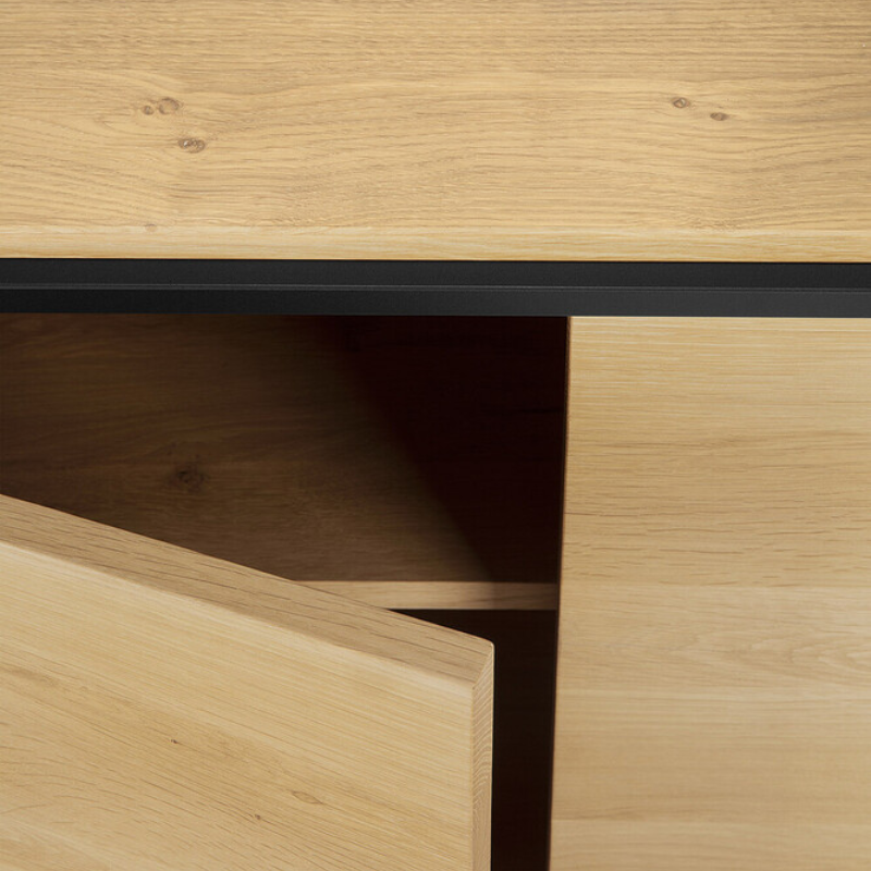 The Monolit Sideboard from Ethnicraft in oak showing the storage.