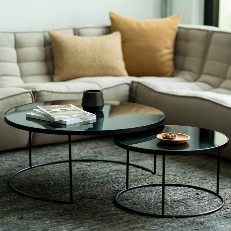 The Nesting Coffee Table Set from Ethnicraft in a lounge.