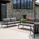 The Nomad Indoor and Outdoor Rug from Ethnicraft in an outdoor living room.