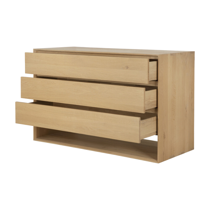 The Nordic Dresser from Ethnicraft with three open drawers.