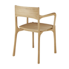 The PI Dining Chair from Ethnicraft with an armrest from the back.