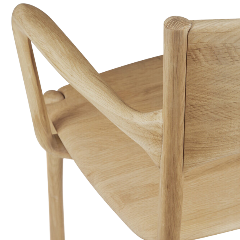 The PI Dining Chair from Ethnicraft with an armrest in detail.