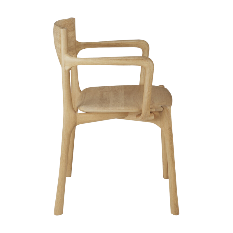 The PI Dining Chair from Ethnicraft with an armrest from the side.