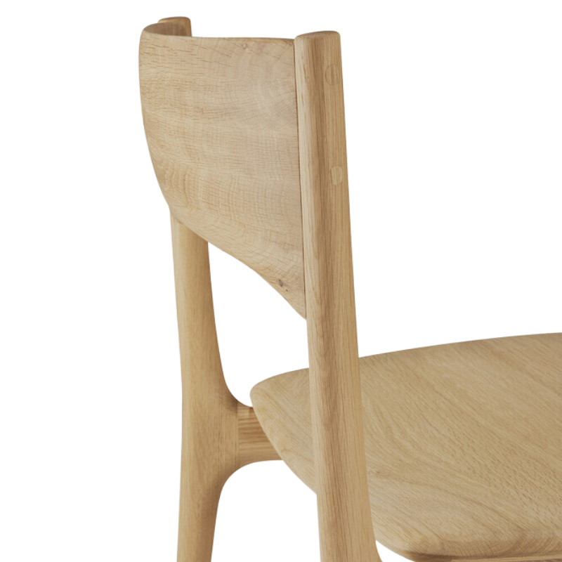 The PI Dining Chair from Ethnicraft without an armrest focusing on the backrest.