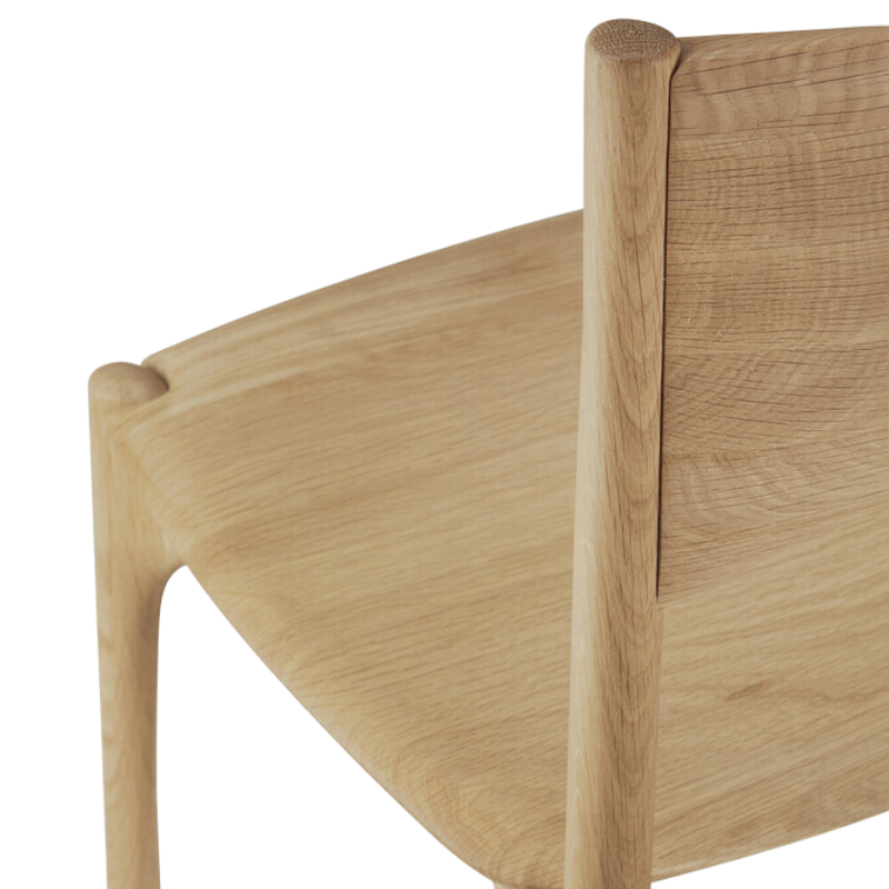 The PI Dining Chair from Ethnicraft without an armrest highlighting the seat.