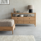 The Spindle Dresser from Ethnicraft in a bedroom.