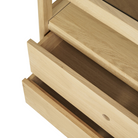 The Spindle Dresser from Ethnicraft in oak in a close up of the drawers.