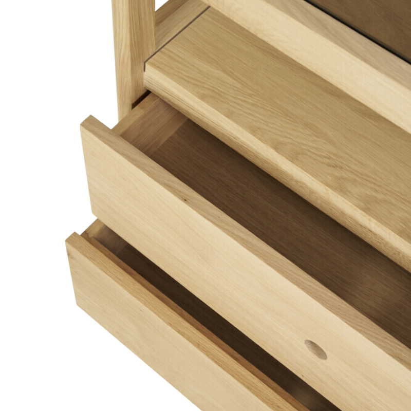 The Spindle Dresser from Ethnicraft in oak in a close up of the drawers.