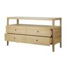 The Spindle Dresser from Ethnicraft in oak with four open drawers.