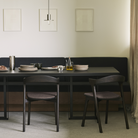 The Tacet Dining Table from Ethnicraft in a dining room.