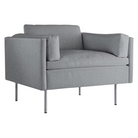 The Bolster Armchair from Herman Miller in heathered cool grey, cozy upholstery from an angle.