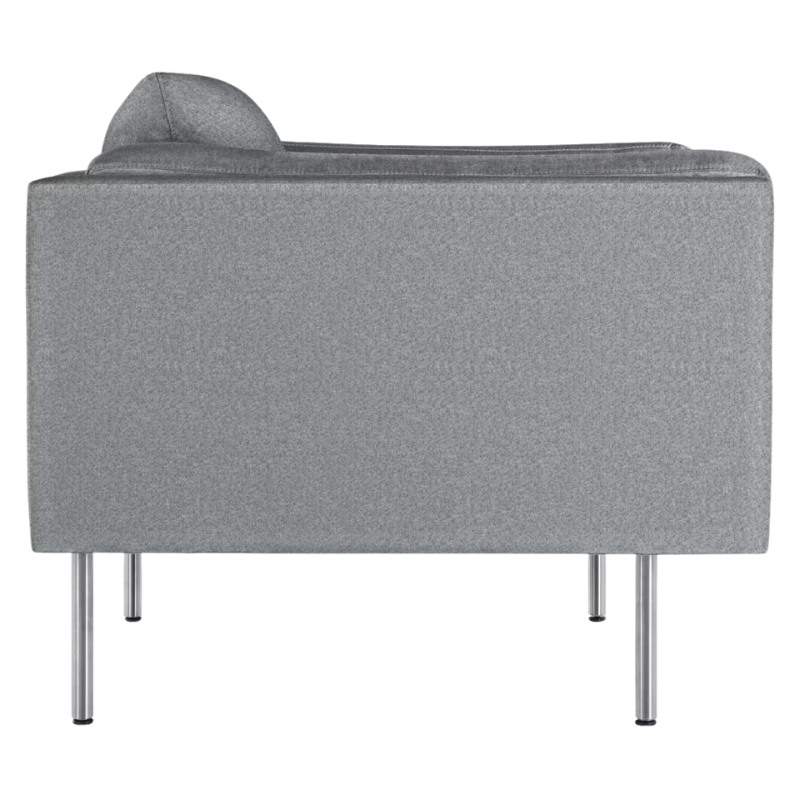 The Bolster Armchair from Herman Miller in heathered cool grey, cozy upholstery from the side.