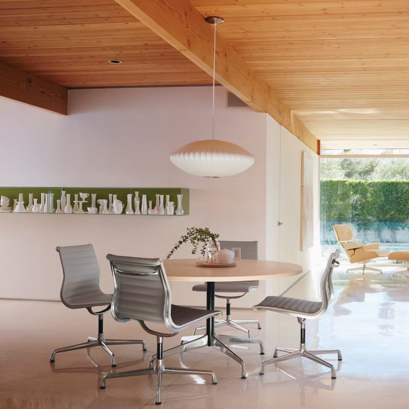 The Eames Aluminum Group Side Chair from Herman Miller in a lounge.