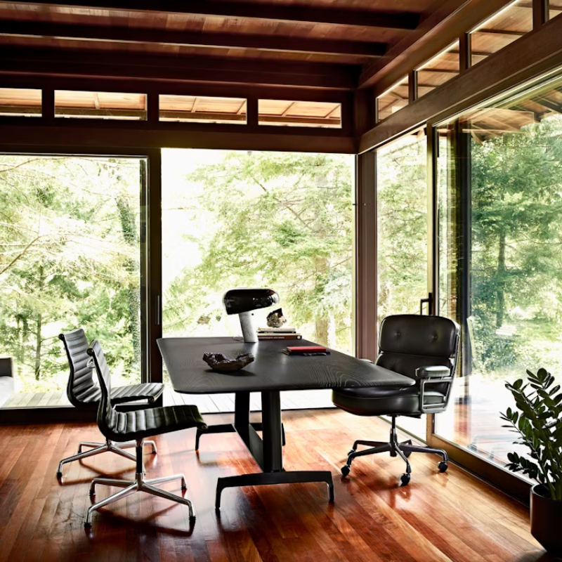 The Eames Aluminum Group Side Chair from Herman Miller in an office.