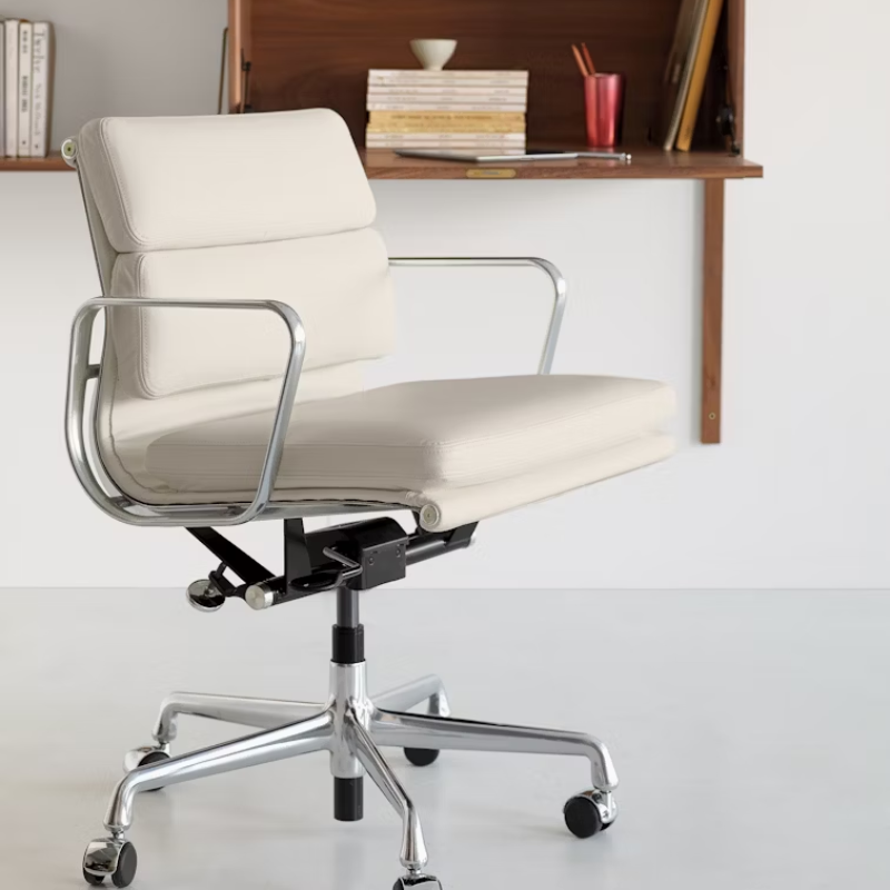 The Eames Soft Pad Management Chair from Herman Miller in a living room.