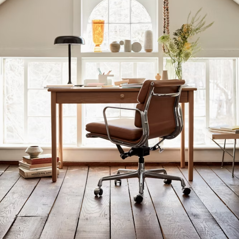 The Eames Soft Pad Management Chair from Herman Miller in a lounge.