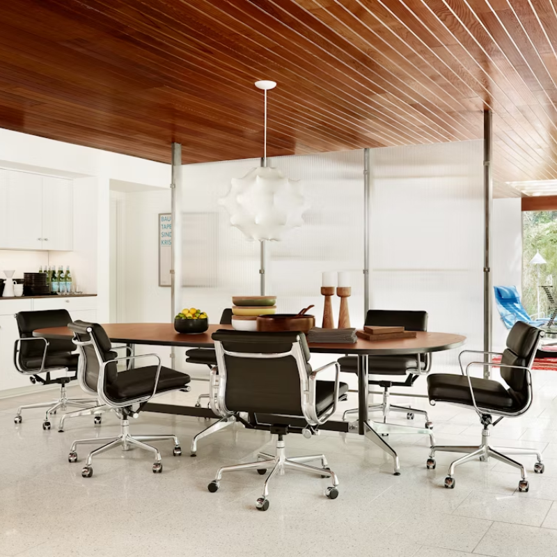 The Eames Soft Pad Management Chair from Herman Miller in a meeting room.