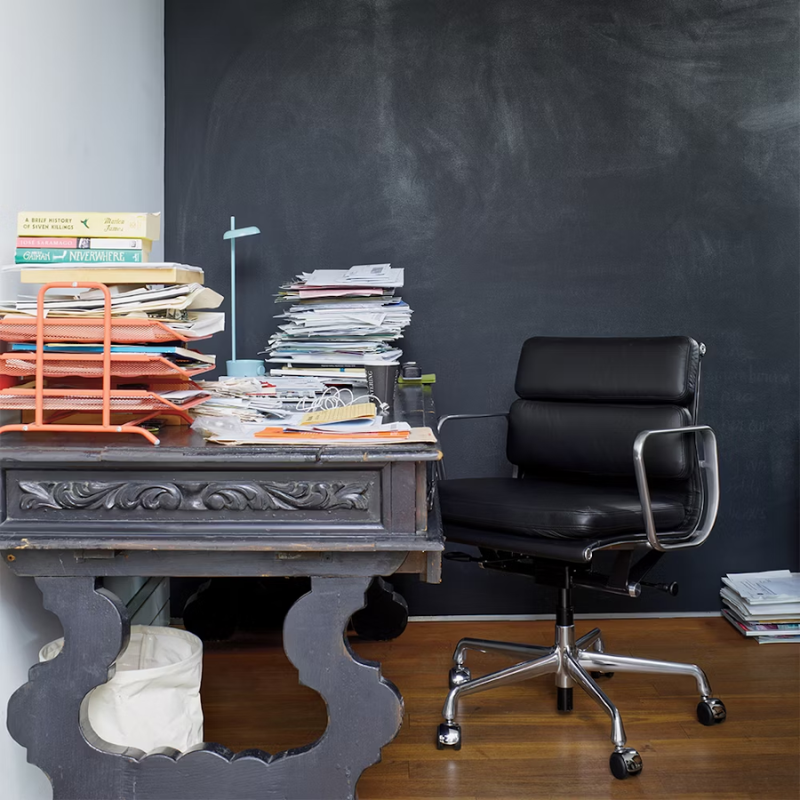 The Eames Soft Pad Management Chair from Herman Miller in an office.