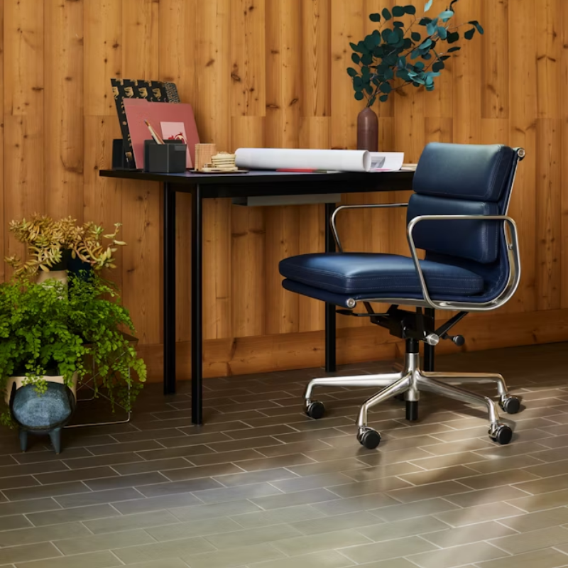 The Eames Soft Pad Management Chair from Herman Miller in a workspace.