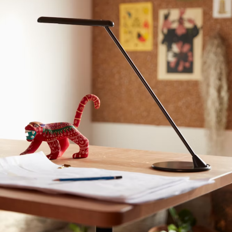 The Flute Personal Light from Herman Miller in a home office.