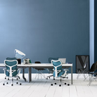 The Mirra 2 Chair from Herman Miller in dark turquoise in a meeting room.