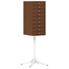 The Nelson Miniature Chest 9 Drawer from Herman Miller in walnut with a studio white base and polished aluminum pulls.