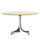 The Nelson Pedestal Coffee Table from Herman Miller with white table top and polished aluminum base.