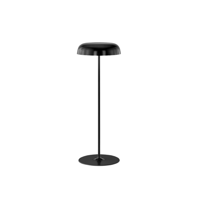 The Ode Freestanding Floor Lamp from Herman Miller sofa height in black.