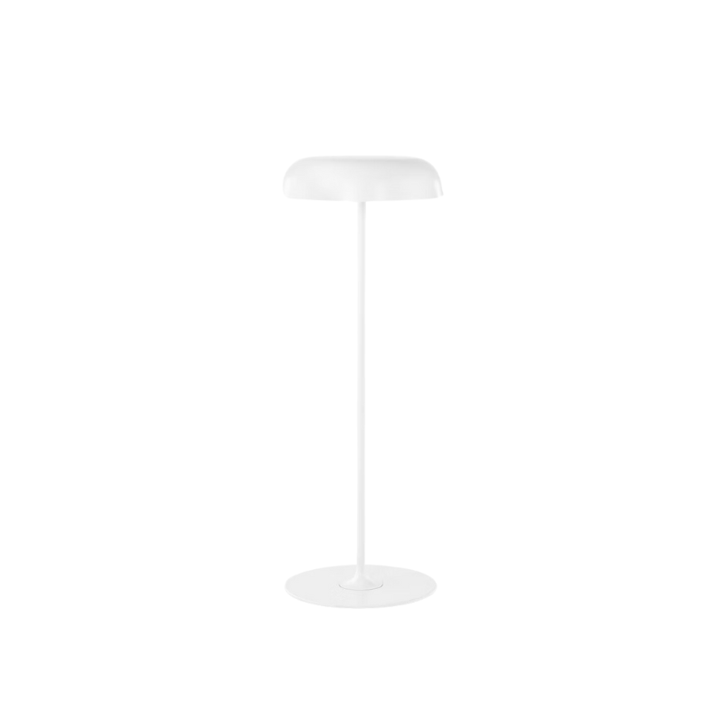 The Ode Freestanding Floor Lamp from Herman Miller sofa height in white.