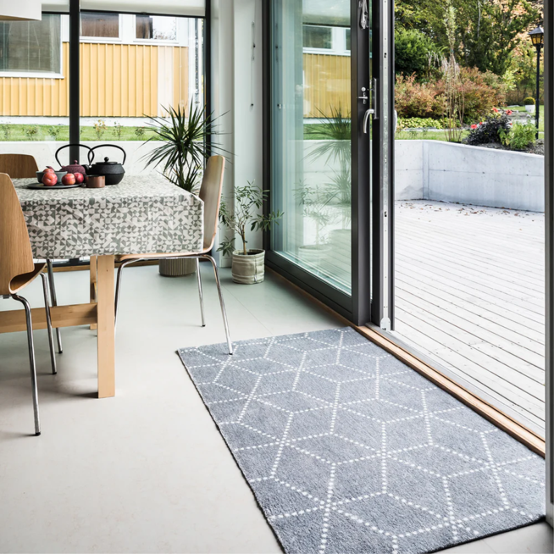 The Hagl Doormat from Heymat in silver in an entryway. 