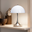 The Panthella 160 Portable Lamp from Louis Poulsen in a close up lifestyle.