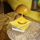 The Panthella 160 Portable Lamp from Louis Poulsen in yellow.