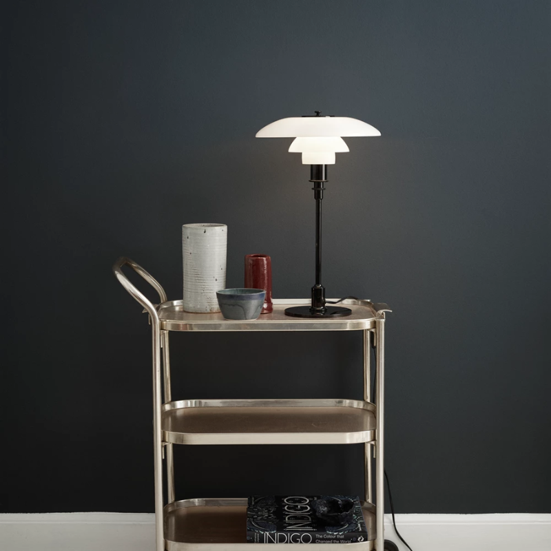 The PH 3/2 Glass Table Lamp from Louis Poulsen in a family area.