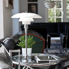 The PH 3/2 Glass Table Lamp from Louis Poulsen in a living room.