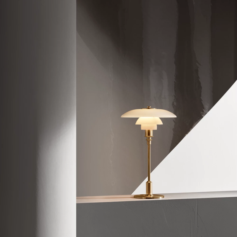 The PH 3/2 Glass Table Lamp from Louis Poulsen in a studio.