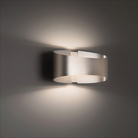 The Swerve Wall Sconce from Modern Forms in a family area.