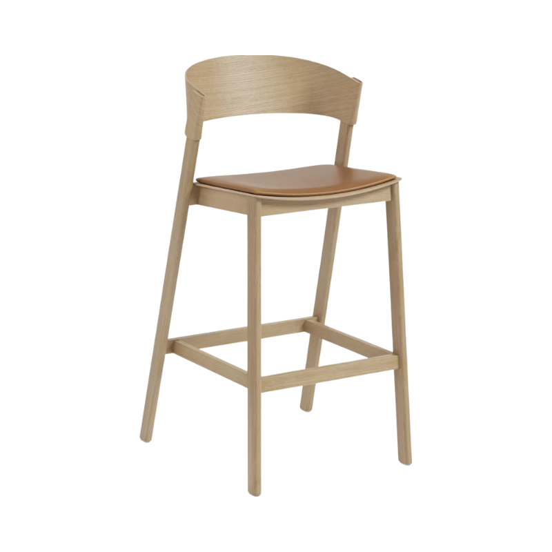 Bar stool with back. Cover Bar Stool by Muuto in oak with cognac leather upholstery. 