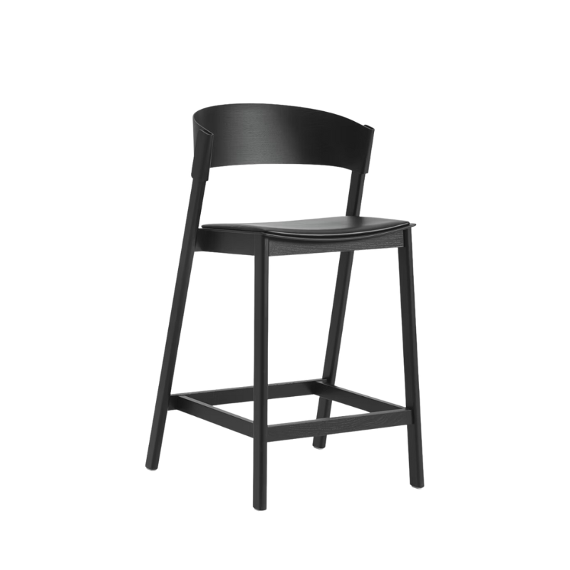 Muuto cover counter stool in black with black refine leather upholstered seat.