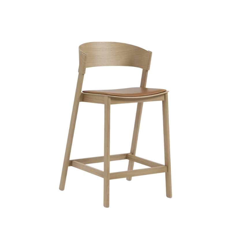 Muuto cover counter stool in oak with coganc refine leather upholstered seat.