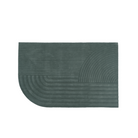 The large Relevo Rug from Muuto in dark green.