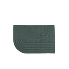 The small Relevo Rug from Muuto in dark green.